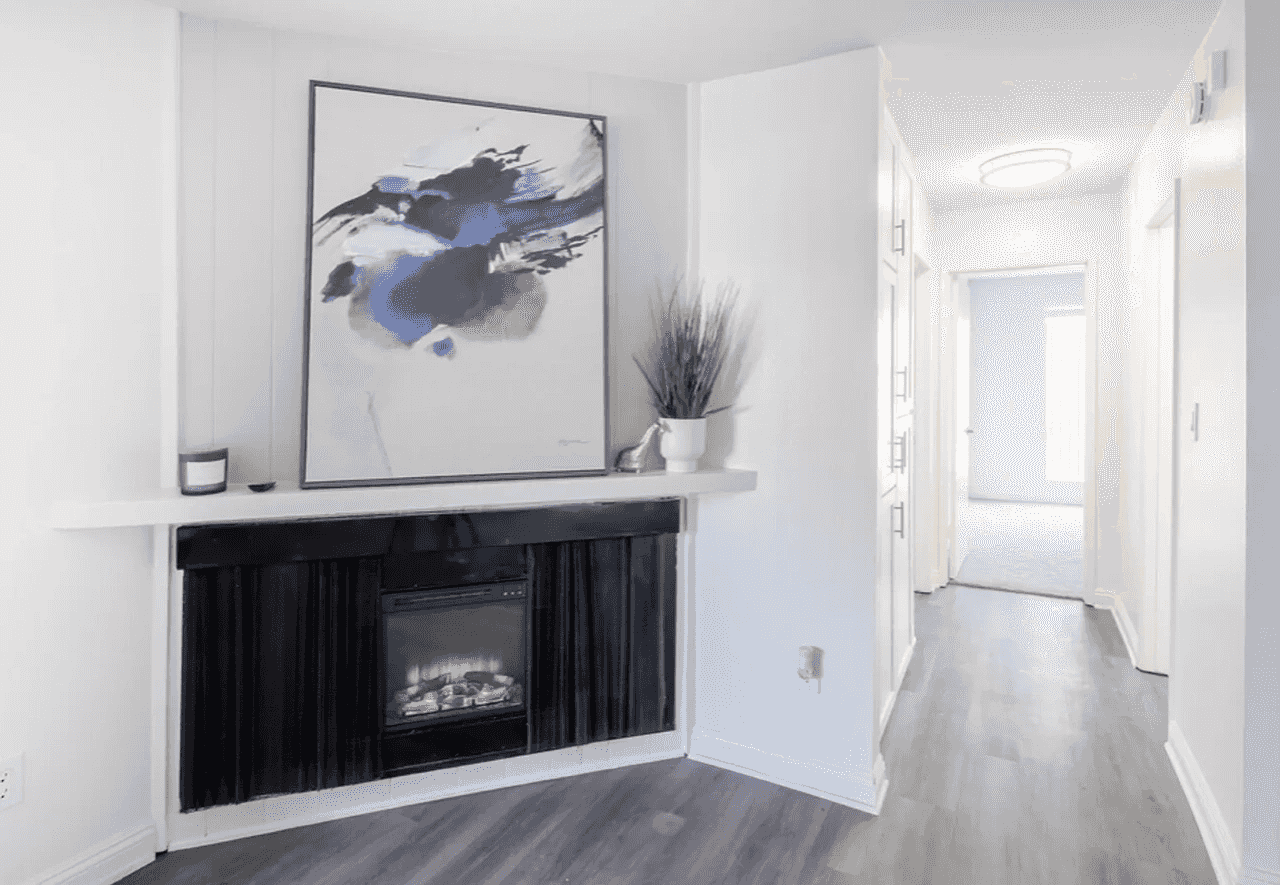 livingroom fireplace painting bright hallway