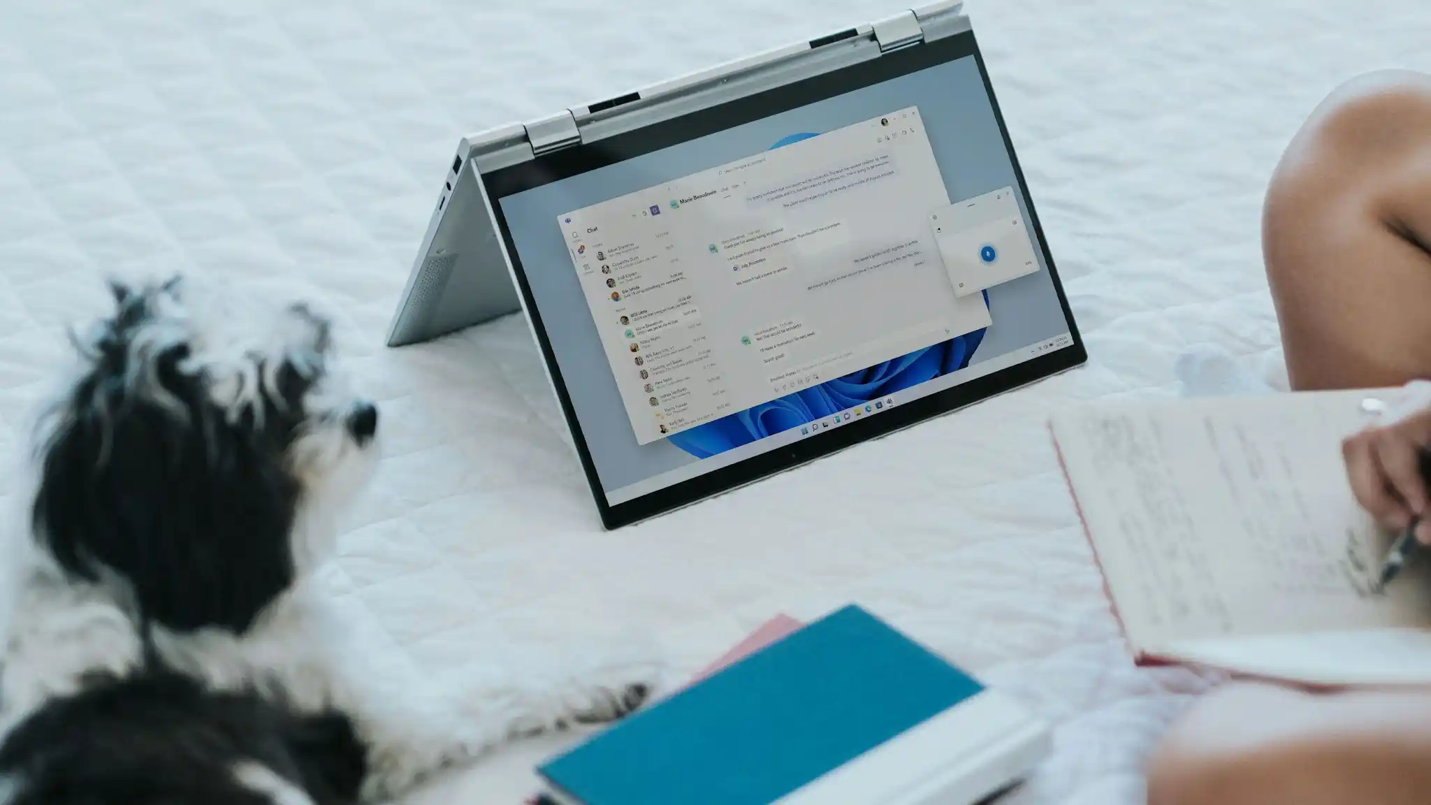 Artesia Crossings Apartments apartment bedroom styled with coffee and reading glasses on bed